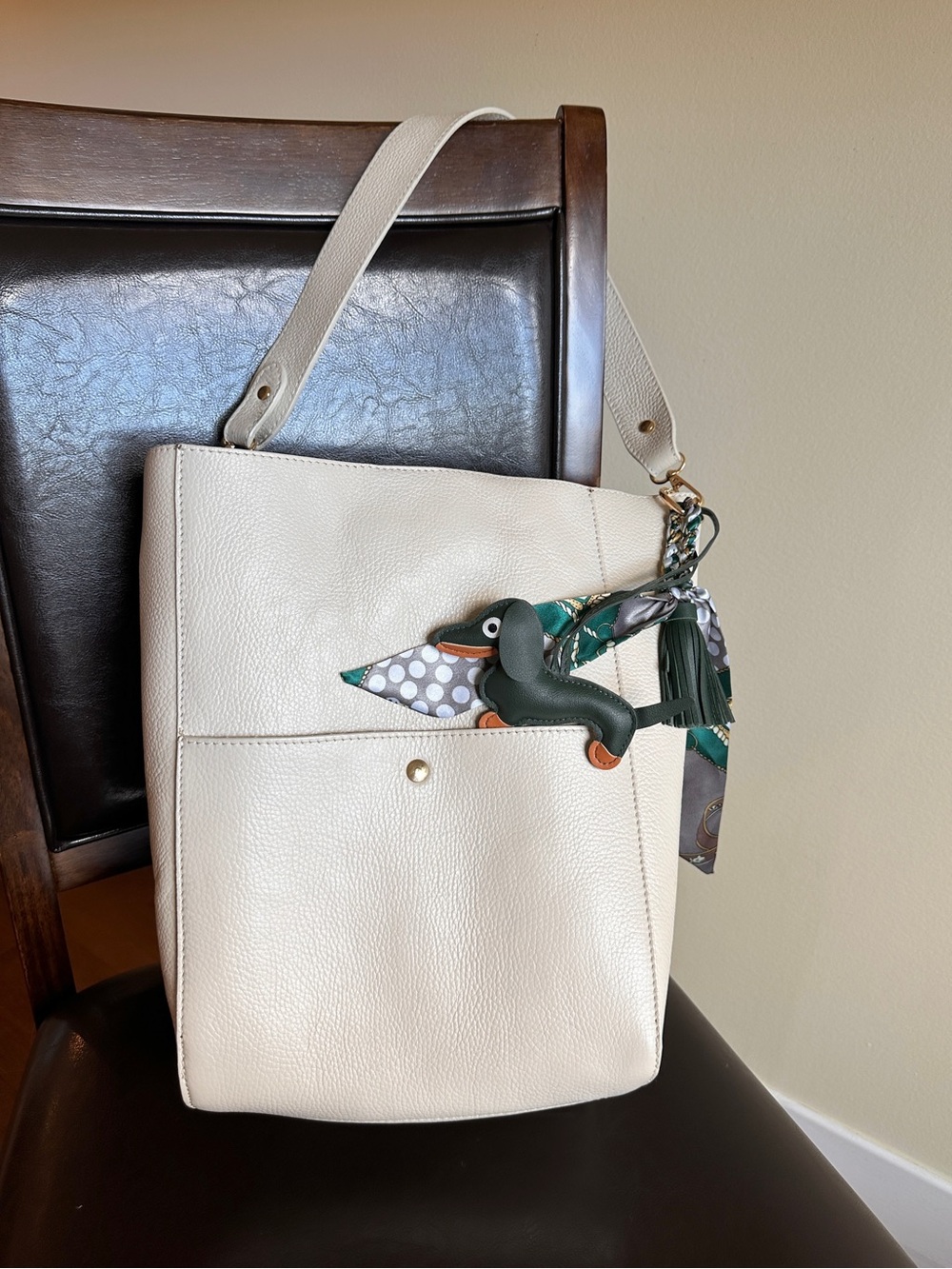 Simons Bucket Cream Shoulder Bag with Green Charm and Silk Scarf Accent